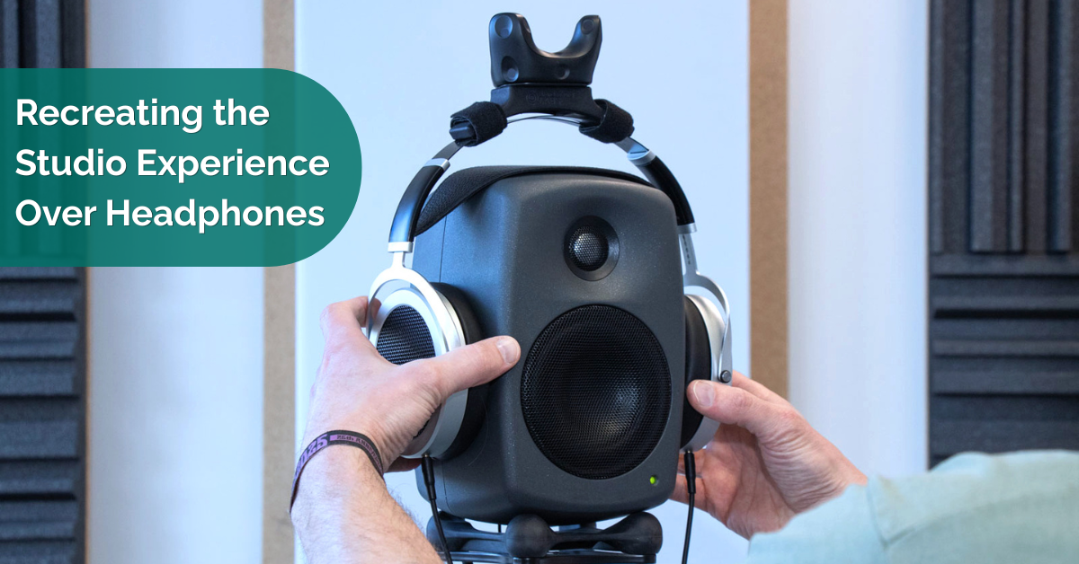 Recreating the Studio Experience Over Headphones A speaker on a stand on which headphones with a tracking unit are placed